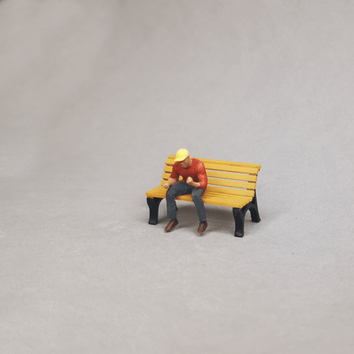 1-64 diorama seated black guy in a cap