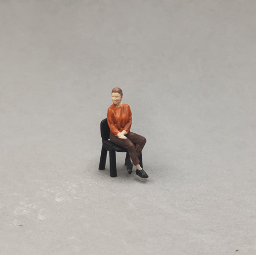 1-64 scale young sitting woman figurine
