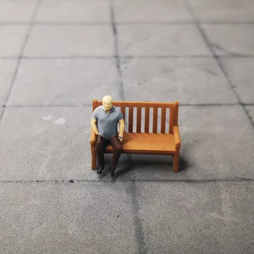 Bald seated man in 1/64 scale